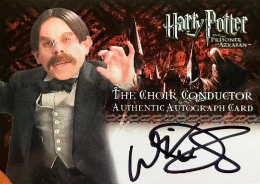 Warwick Davis as The Choir Conductor - Front